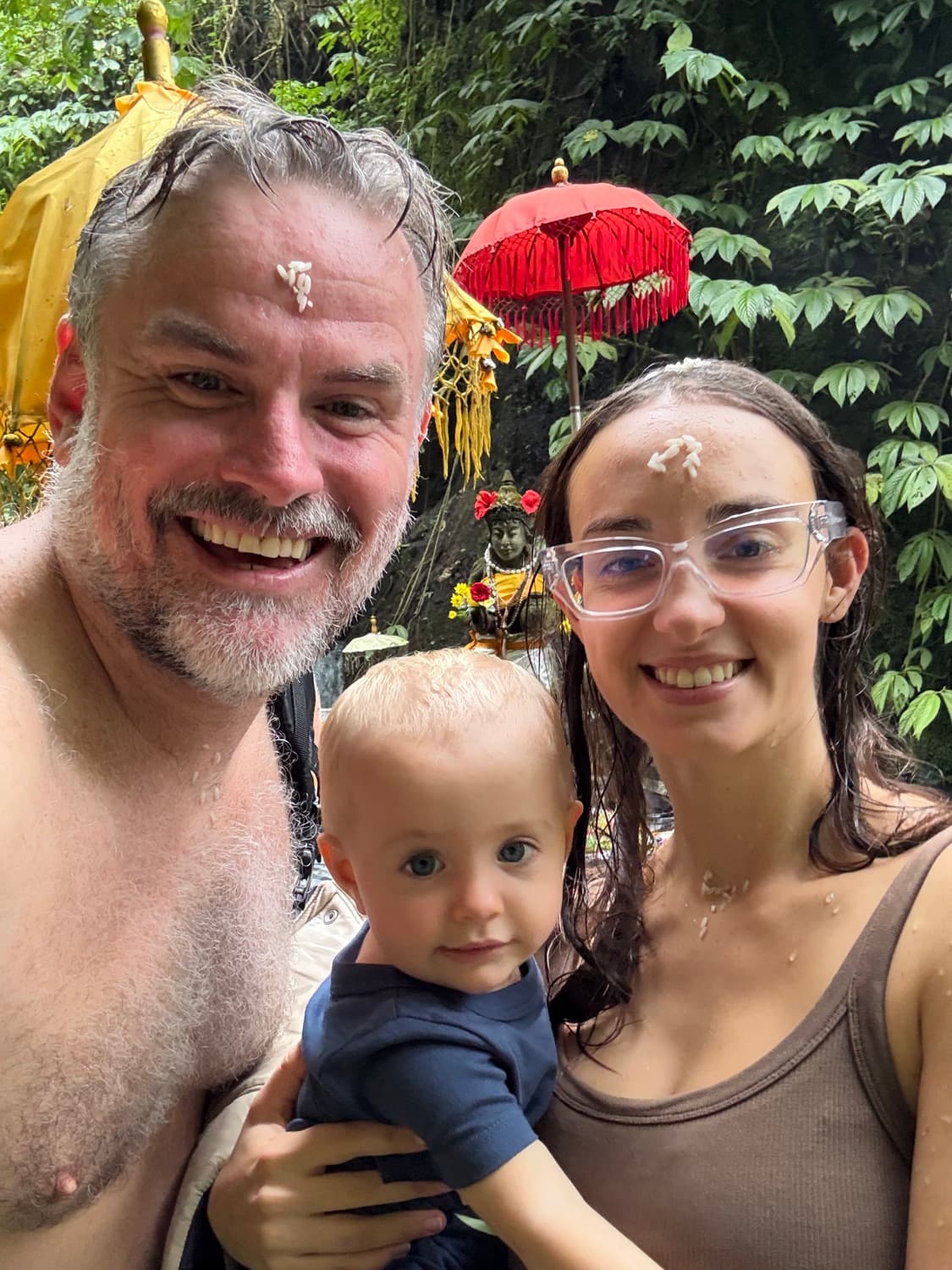 Shane, Nina and Delphi at a water-blessing temple in Bali
